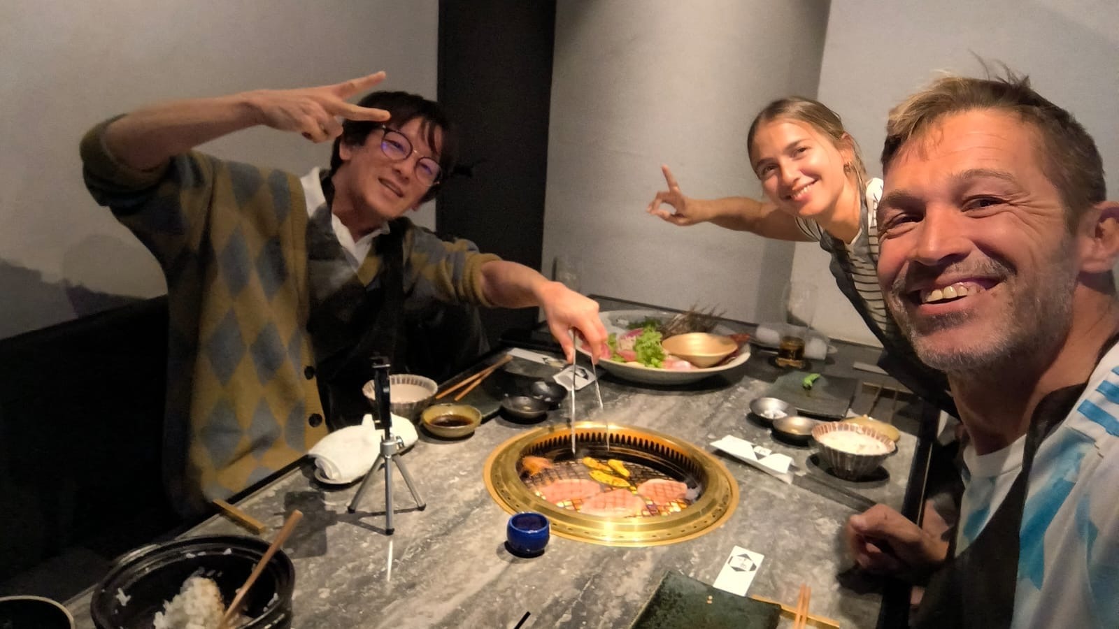 Happy international guests enjoying premium yakiniku dinner with private tour guide Mao in Tokyo